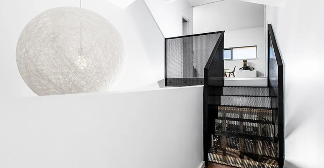 Interior staircase and feature pendant in a Cottesloe modular addition