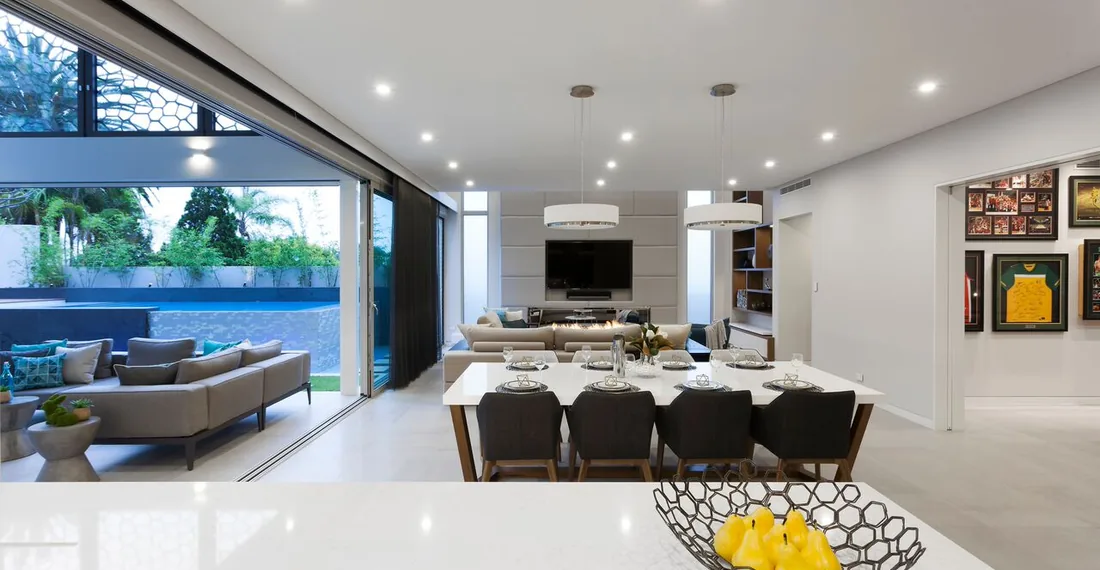 Open-plan residential living and dining room beside an outdoor terrace