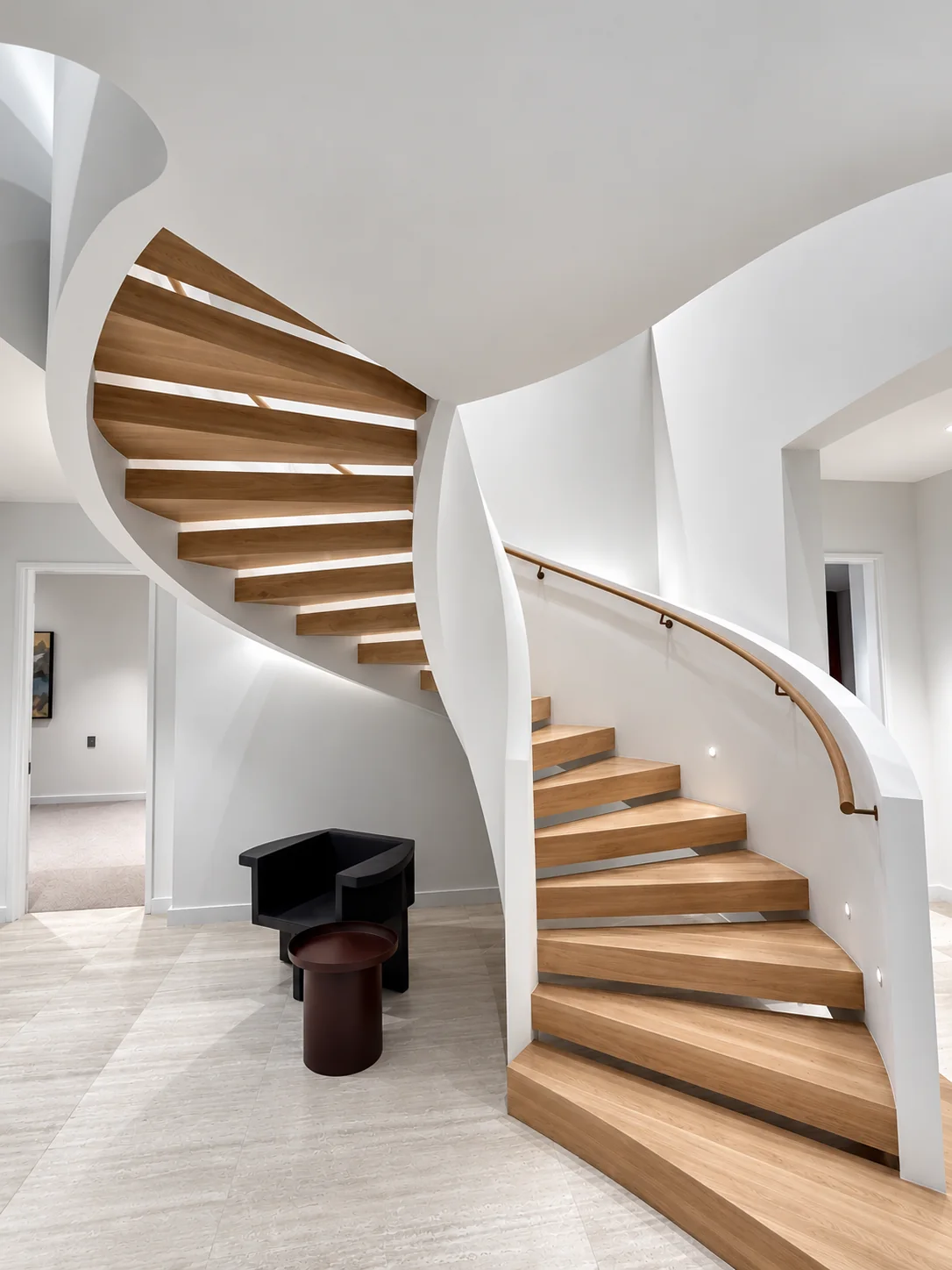 Sculptural curved staircase with Level 5 plasterboard finishing